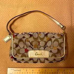 COACH Tan Signature Wristlet with Gold Accents and Red Heart Detail